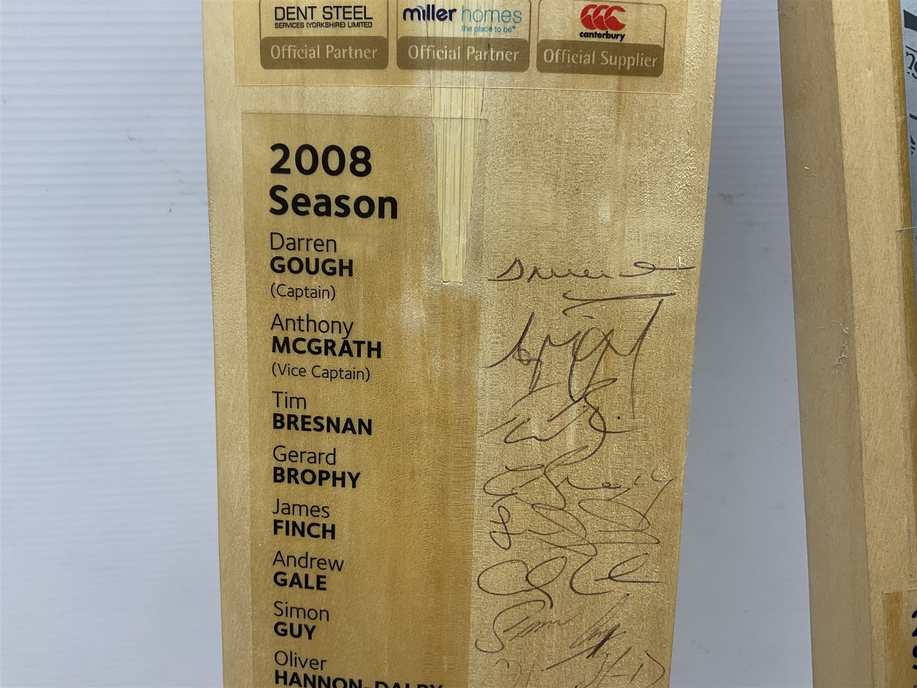 Two signed Yorkshire County cricket bats, from 2007 and 2008 seasons, bearing signatures including Darren Gough, Jason Gillespie, Younus Khan, Michael Vaughn and Tim Bresnan, etc