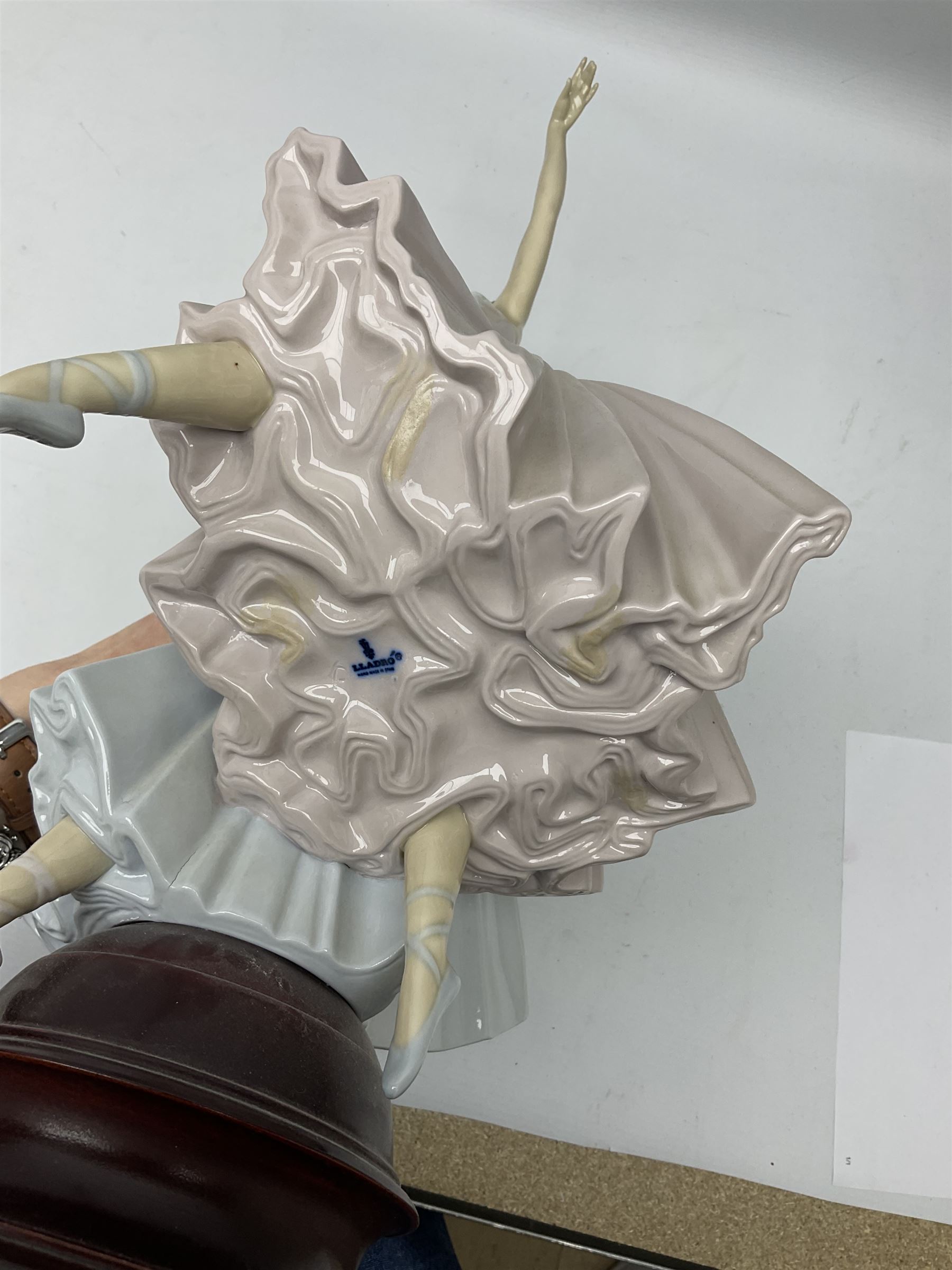 Lladro figure group, 'Merry Ballet', modelled as two ballerinas in dancing pose, raised on a turned socle base, no. 5035, printed marks beneath, H49cm