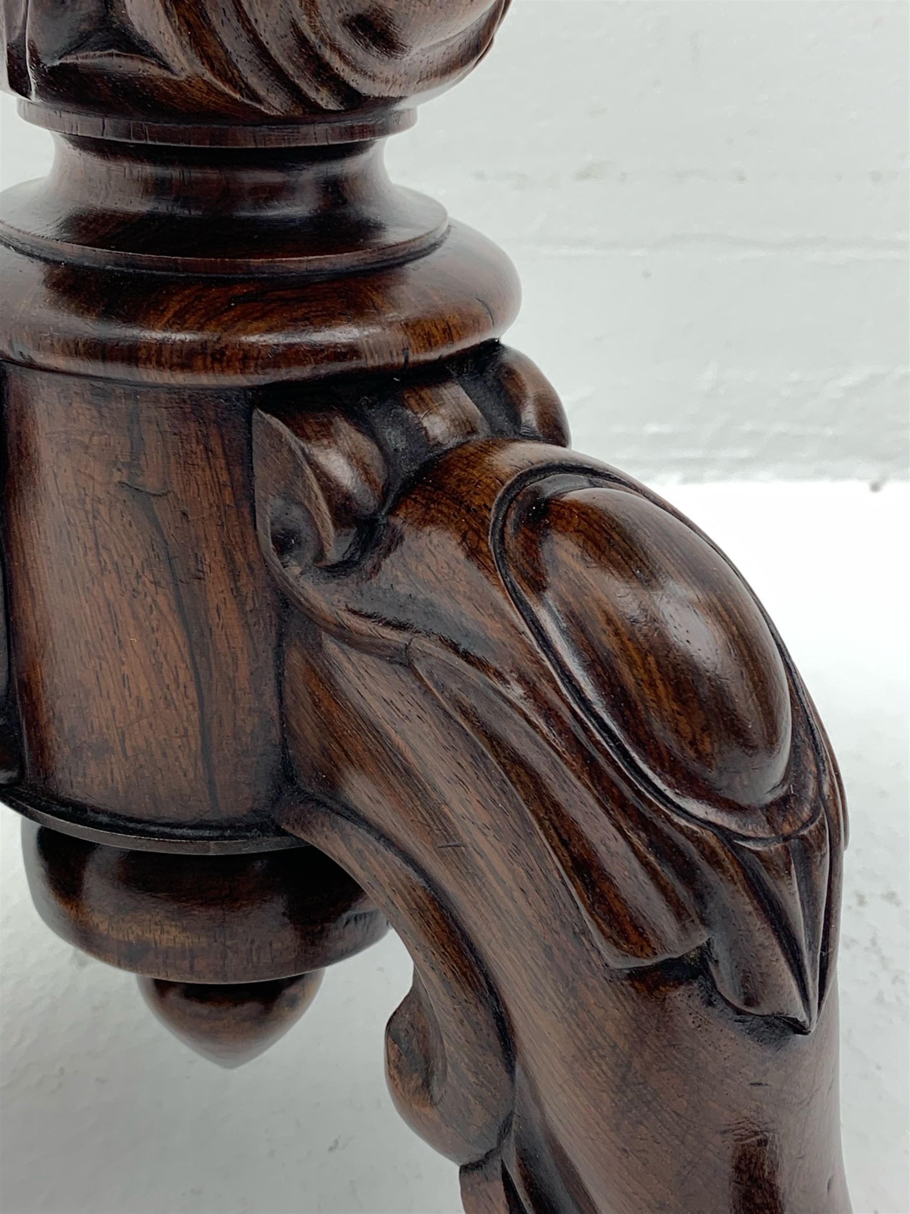 Victorian rosewood rise and fall piano stool, the floral needlework upholstered seat raised on floral and scroll carved tripod base