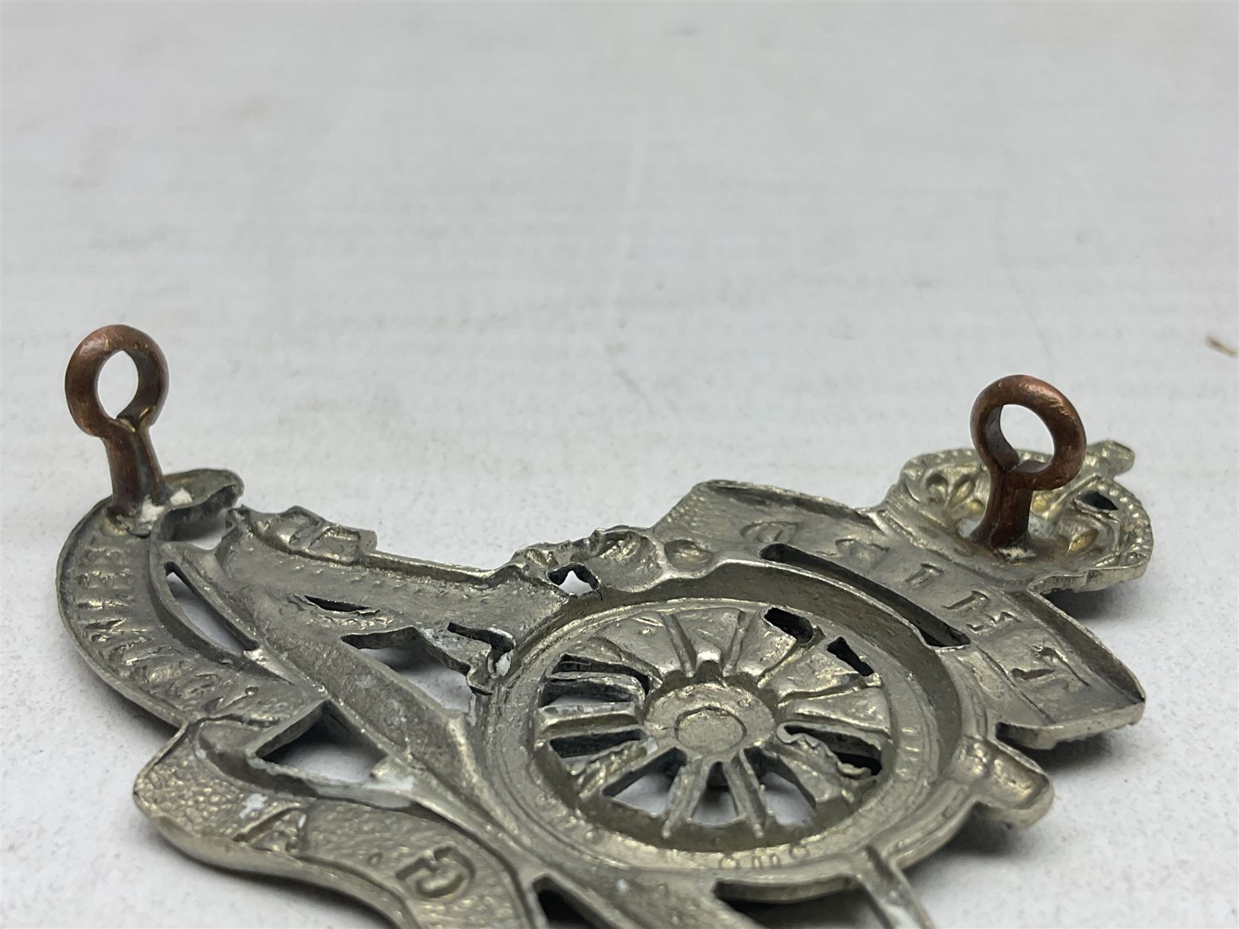 Third Middlesex Royal Garrison Artillery Volunteers Cap Badge, white meta Royal Artillery cap badge with “THIRD” to the top scroll and lower three part scroll “MIDDLESEX – R.G.A. – VOLUNTEERS”. Three lug fittings to the reverse.