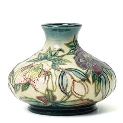 Moorcroft Hellebore pattern vase, of squat baluster form, with impressed and painted marks to base, in original box, H10.5cm 