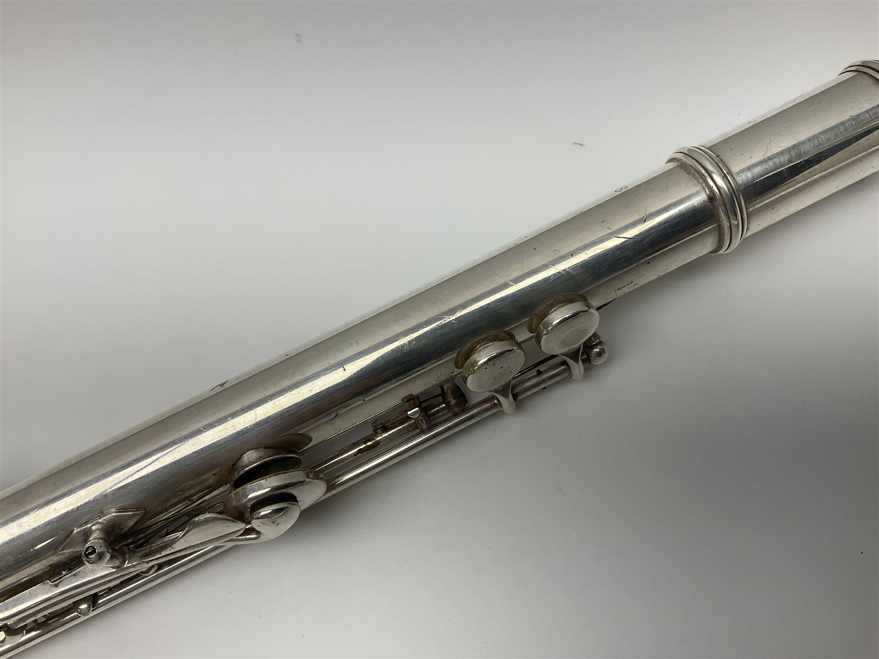Boosey & Hawkes London Regent three-piece flute, serial no.345447; in B&H Bandhite hard carrying case; and Deg Music Company Inc. USA Claudel Model three-piece flute, serial no.491718, in hard carrying case (2)