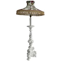 White painted Italian Baroque design standard lamp, ornately cast with foliage and scrolls, on three scrolled feet, with floral shade