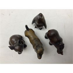 Eight netsuke, modelled as a rabbit, rat, elephant, rhino, dog, owl, penguin and horse