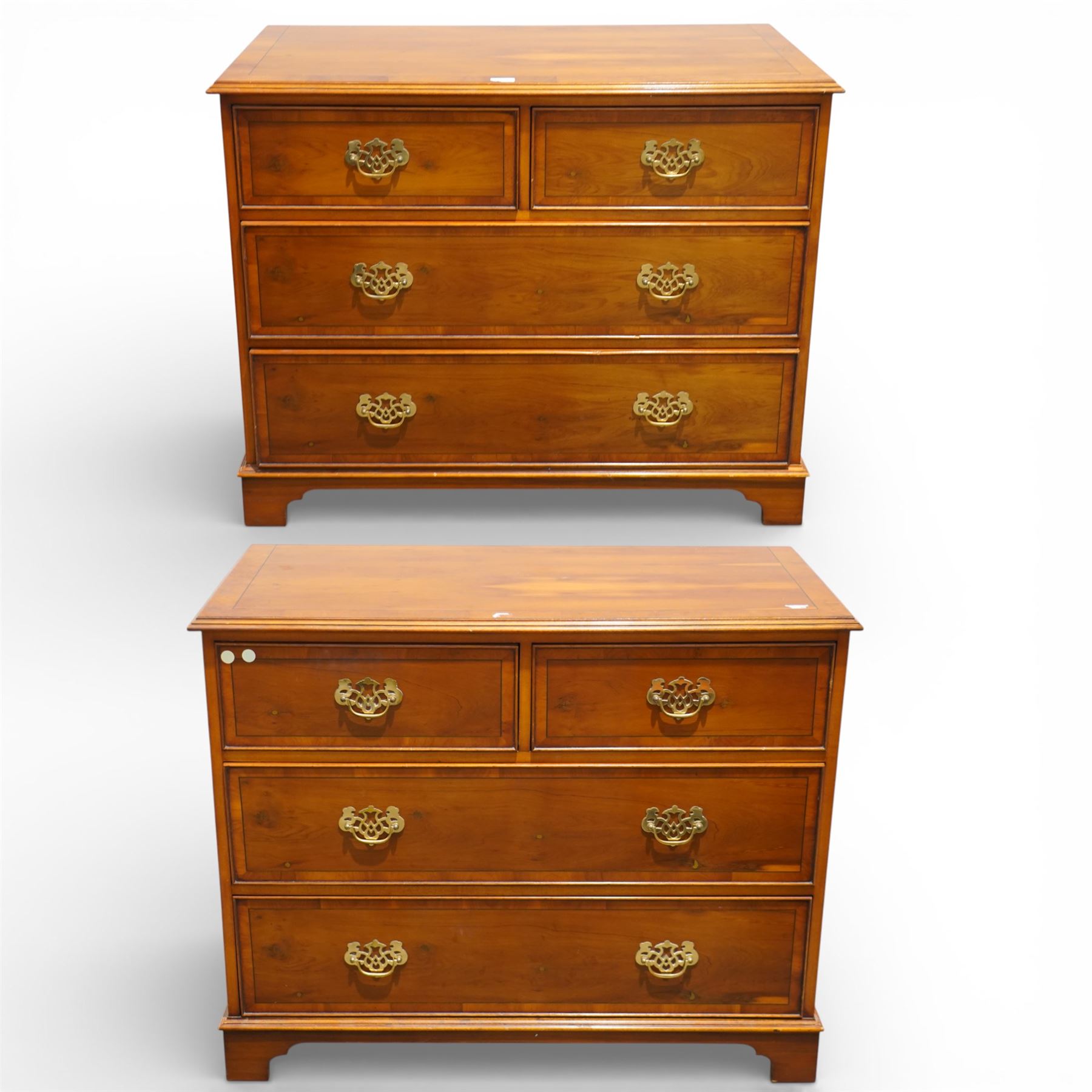 Late 20th century pair of yew wood chests of drawers, each with rectangular tops above two short over two long drawers, cockbeaded drawer fronts fitted with brass swan neck handles, raised on bracket feet