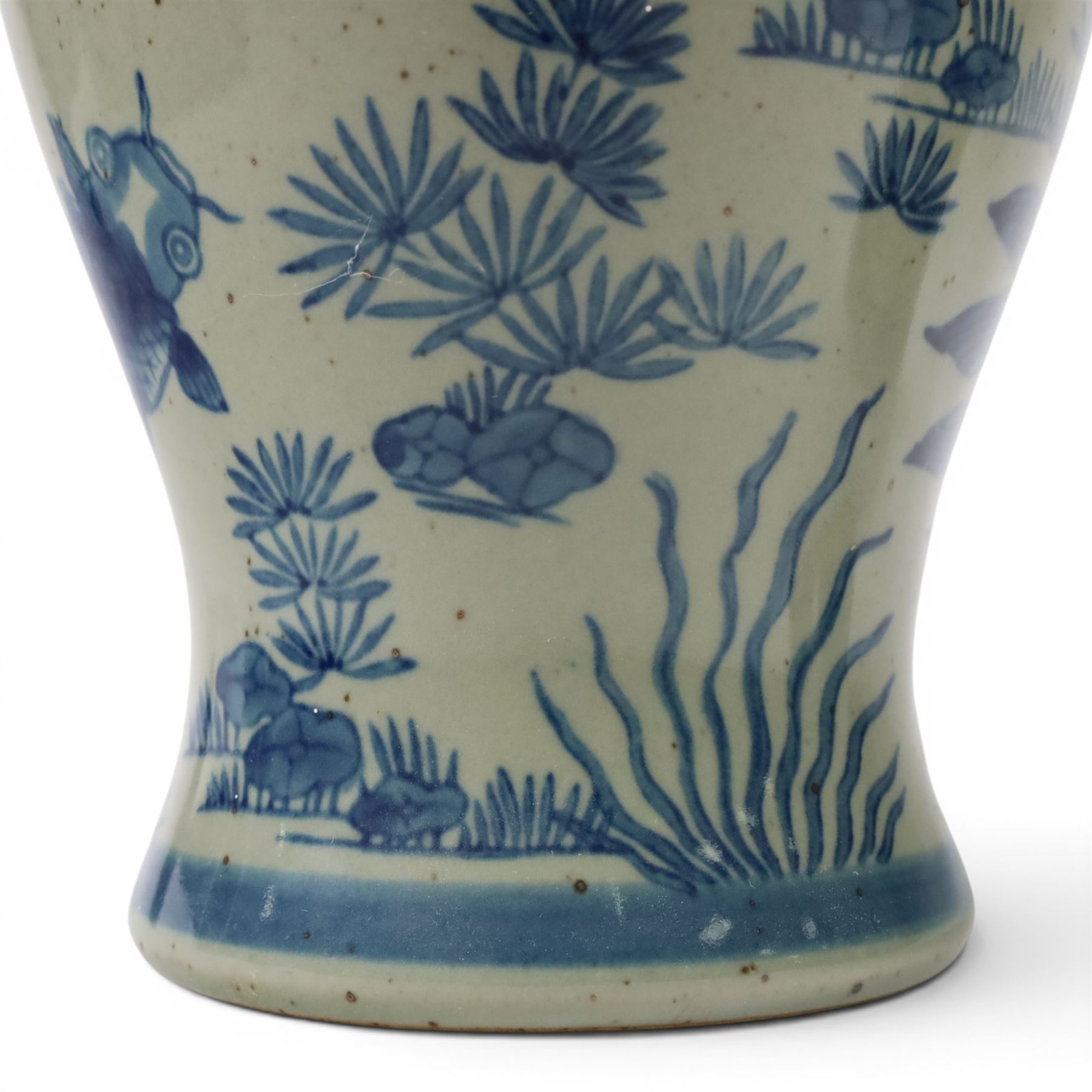 Pair of Chinese blue and white jars and covers, of baluster form, painted with fish and foliage H36cm