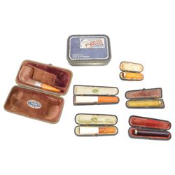Amber gold mounted cheroot holder, 12.5 ct hallmarked, cased, together with another gold mounted example and various others, and silver mounted pipe 