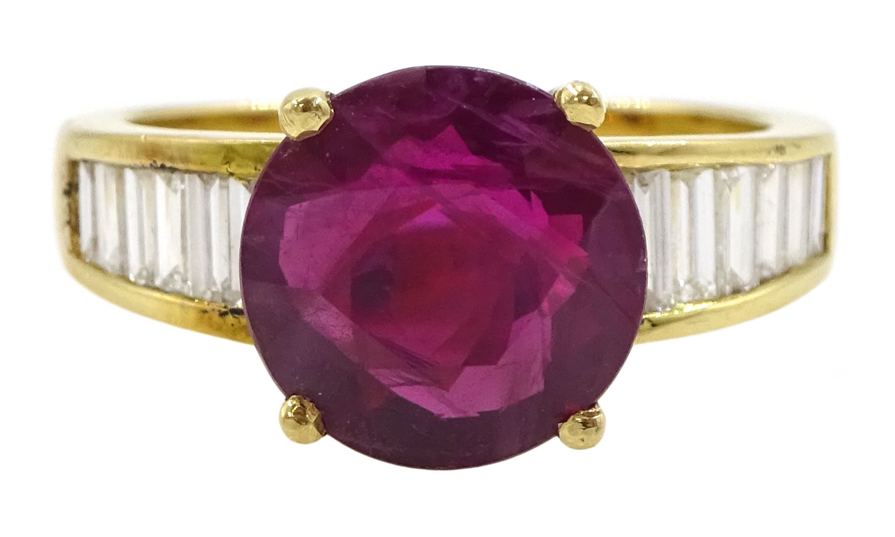 18ct gold ruby and diamond ring, single round cut ruby of approx 3.25 carat, with channel set baguette cut diamond shoulders, total diamond weight approx 0.85 carat