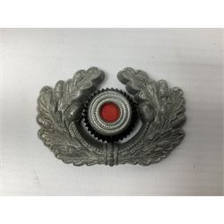 Five WW2 German peaked cap badges, four with double-pinned backs