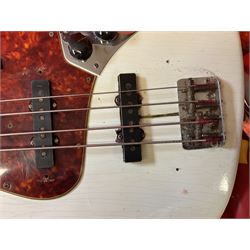 1963 Fender Jazz three-knob bass guitar; impressed with date code 7AUG63A on end of neck and serial no.L08587 on back plate; all original but re-finished in white in the 1970s; sold with photographs of the instrument in the 1960s with original finish and in the 1970s re-finished; L117.5cm; in original hard carrying case; Provenance: the professional guitar of Howard Livett from new to his death in 2005. Howard played in The Humperdincks, the backing group for Englebert Humperdinck, also played in the backing group for Max Bygraves and in the band Hedgehoppers Anonymous. The guitar is also sold with a manuscript letter of provenance from Howard's wife.