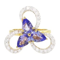 18ct gold tanzanite and diamond cluster ring, three pear cut tanzanite's, with round brill...