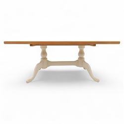 Contemporary light oak dining table, painted tripod bases with stretcher 