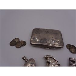 Group of novelty silver items, comprising man in the moon vesta case, perfume pendant and a whistle, unmarked but test silver, together with a mother of pearl handled silver fruit knife, silver cigarette case, both hallmarked and a small quantity of silver threepences