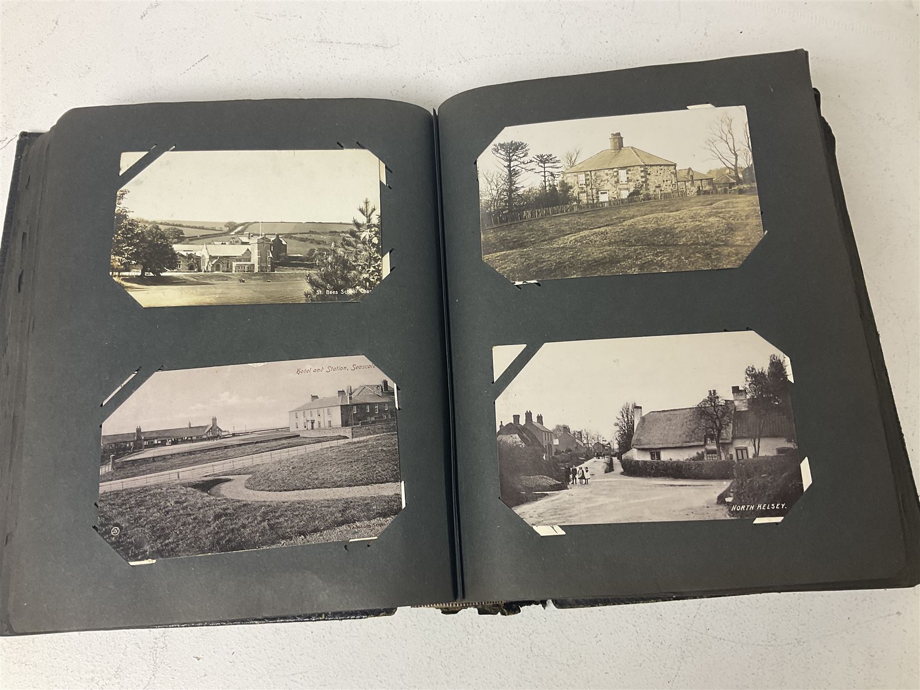 Postcard album with Victorian and later postcards, including silk cards, landscapes of the UK, portraits, Christmas cards etc  