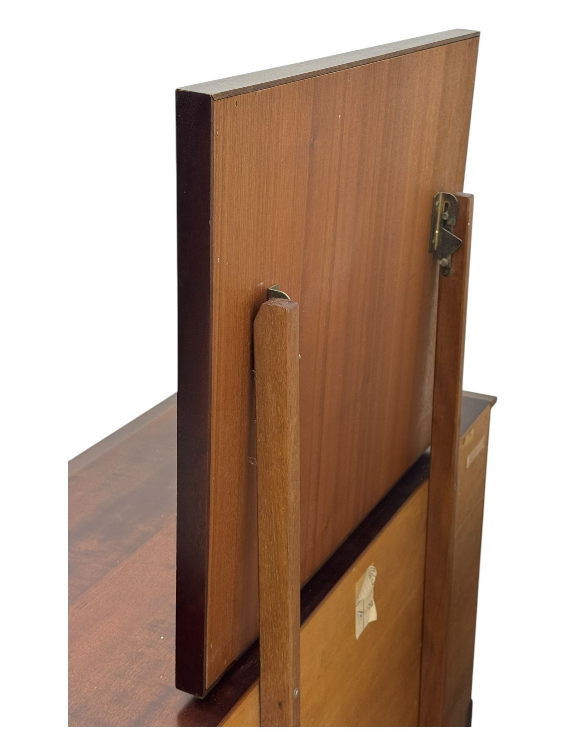 Stag Minstrel - mid-20th century mahogany dressing chest, rectangular top surmounted by adjustable mirror, the upper section fitted with four small drawers over two full-width drawers, on bracket feet