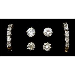 Pair of 18ct white gold illusion set single stone diamond stud earrings, pair of 14ct gold cubic zirconia stud earrings and a pair of 9ct gold diamond hoop earrings