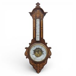 Victorian inlaid rosewood aneroid wall barometer, the circular glass-printed dial with brass bezel, with weather indications for Stormy, Rain, Change, Fair, and Very Dry, with enclosed aneroid movement beneath, shaped case with marquetry scrolls and foliate motifs surmounted by a thermometer with dual Fahrenheit and Centigrade scales, circa 1890-1900