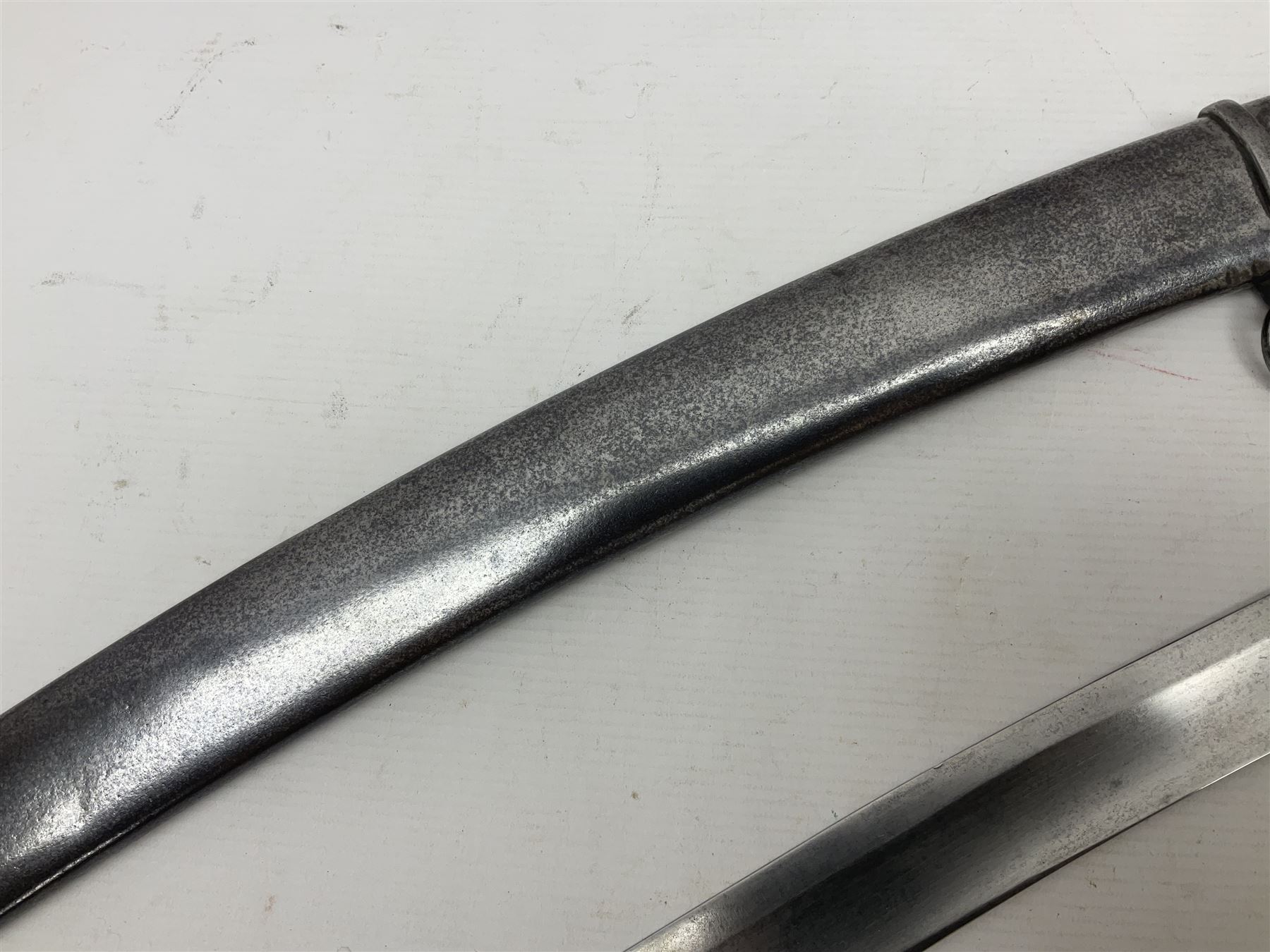 British 1796 Pattern Light Cavalry trooper's sword, the 84cm curving fullered blade stamped Hadley.1 to the back edge, steel hilt with knucklebow, D-shaped langets and leather grip; in polished steel scabbard stamped Osborn & Gunby Birmm. and W.R.16 ( ?16th Light Dragoons) with two suspension rings L100cm overall