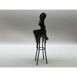 Art Deco style bronze modelled as a bare chested female figure seated upon a chair, after 'Pierre Collinet', H28cm