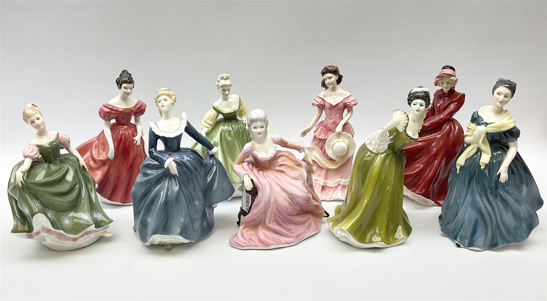 A group of eight Royal Doulton figures, comprising Simone HN2378, Amy HN3854, Fragrance HN2334, Louise HN3207, Adrienne H2304, Michele HN2234, Fine Lady HN2193, Winsome HN2220 and a Coalport figure, Polly. 