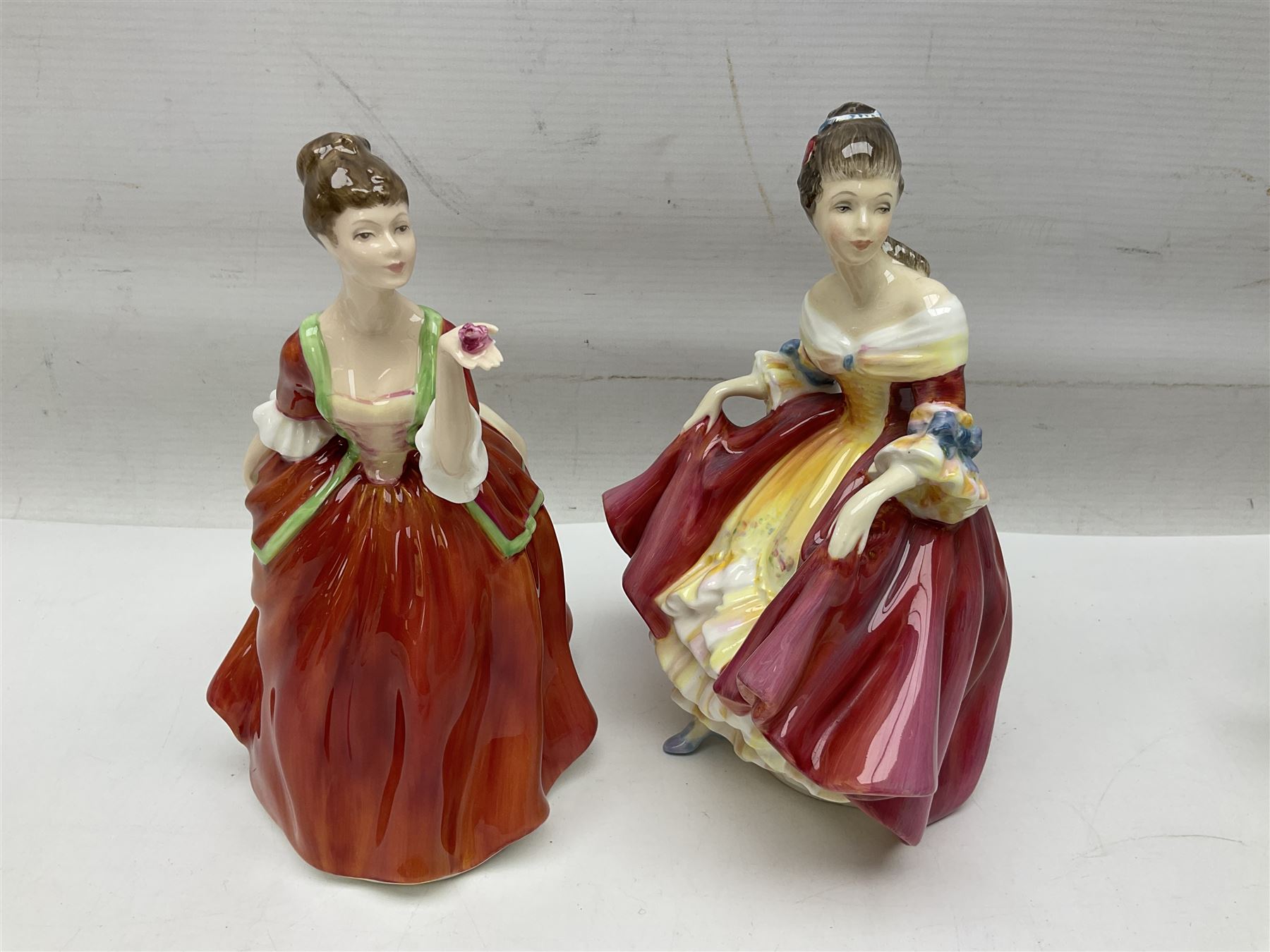 Five Royal Doulton figures, comprising Flower of Love HN3970, Emily HN3688, Southern Belle HN2229, Helen HN3886 and My Love HN2339, all with printed mark beneath, some with boxes, together with a Royal Doulton Figures reference book by D Eyles and R Dennis