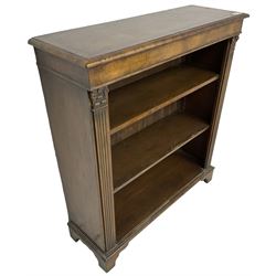 Georgian design walnut open bookcase, fluted uprights with acanthus carved capitals enclosing two adjustable shelves, on bracket feet