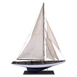 Three wooden model ships, comprising a single mast Schooner style pond yacht, a kit-built Viking longship and a model of HMS Endeavor, Schooner H117cm