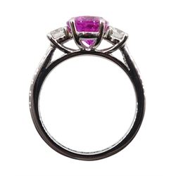 Platinum three stone oval pink sapphire and round brilliant cut diamond ring, hallmarked, sapphire approx 2.20 carat, total diamond weight approx 0.50 carat