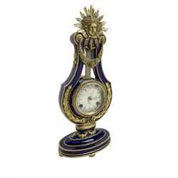 20th century V&A Marie Antionette lyre clock - Blue porcelain with gilt mounts on a  oval stepped base, dial with roman numerals and gilt hands, continental twin train spring driven movement sounding the hours and half hours on two bells. With key.