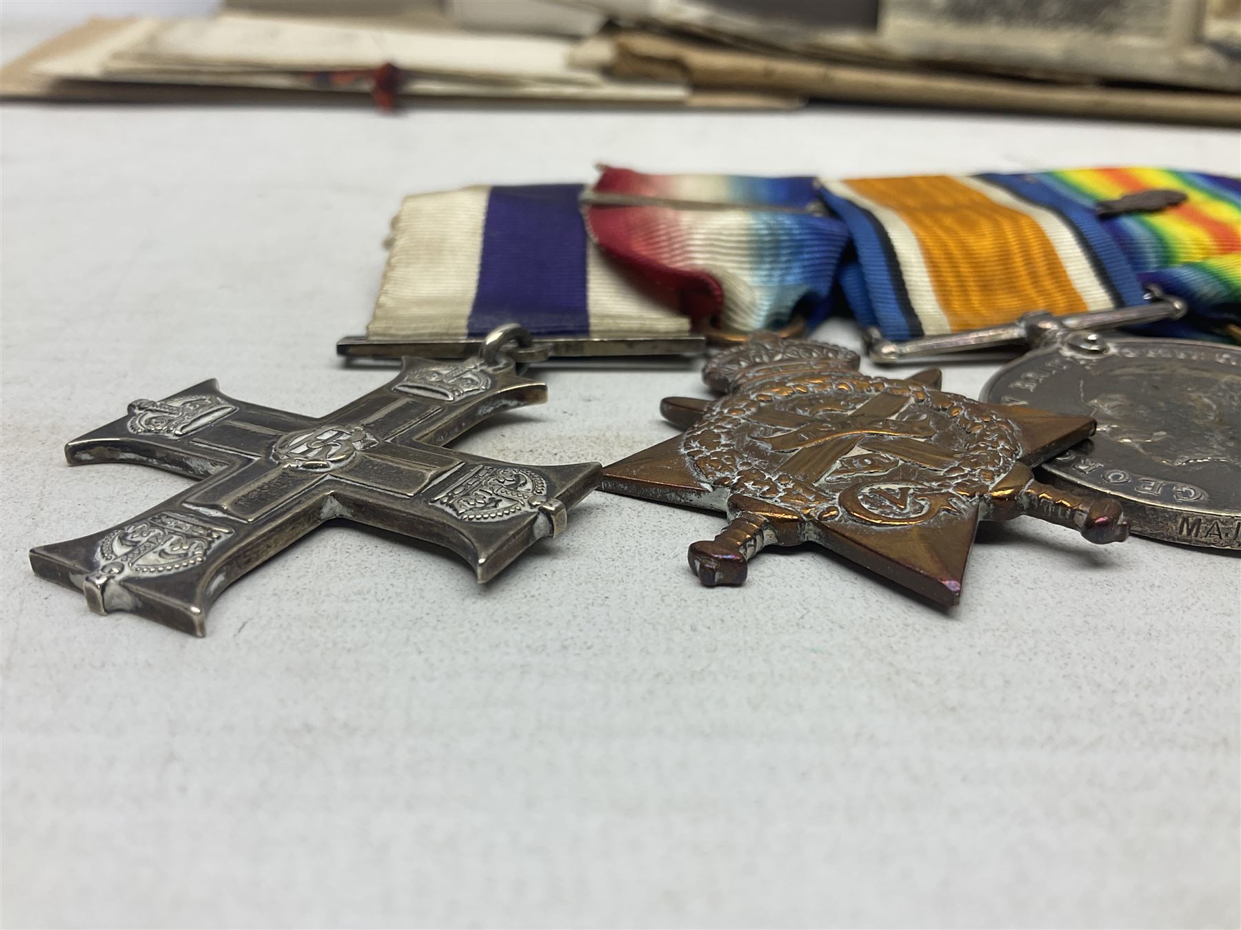 WW1/WW2 Military Cross group of five medals comprising M.C., 1914 Star with date clasp to 34156 Sjt. G. Ferguson R.F.A., British War Medal and Victory Medal with MID leaves to Major G. Ferguson, WW1 French Croix De Guerre with MID Star and WW2 Defence Medal; all with ribbons on pinned wearing bar; WW1 group of five miniature dress medals; two Royal West Kent cap badges; early 20th century silver cigarette case engraved with GF monogram and adapted as a photograph holder with image of Ferguson in civilian clothing; presentation Rotary 9ct gold cased wrist-watch with 1931 British Legion inscription verso; and archive of ephemera including 1914 MID certificate; WW2 Home Guard certificate; over twenty career spanning photographs of Regimental groups, portraits, Sandhurst etc; 1914 Commission document to 2nd Lieutenant; 11th Brigade R.F.A. Roll of Honour 1914-18; 'Soldier's Small Book'; Army Book 439 etc