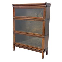 Globe Wernicke - early 20th century mahogany three-tier stacking library bookcase, three glazed sections enclosed by hinged and sliding doors, interior with transfer label, raised on cabriole front supports