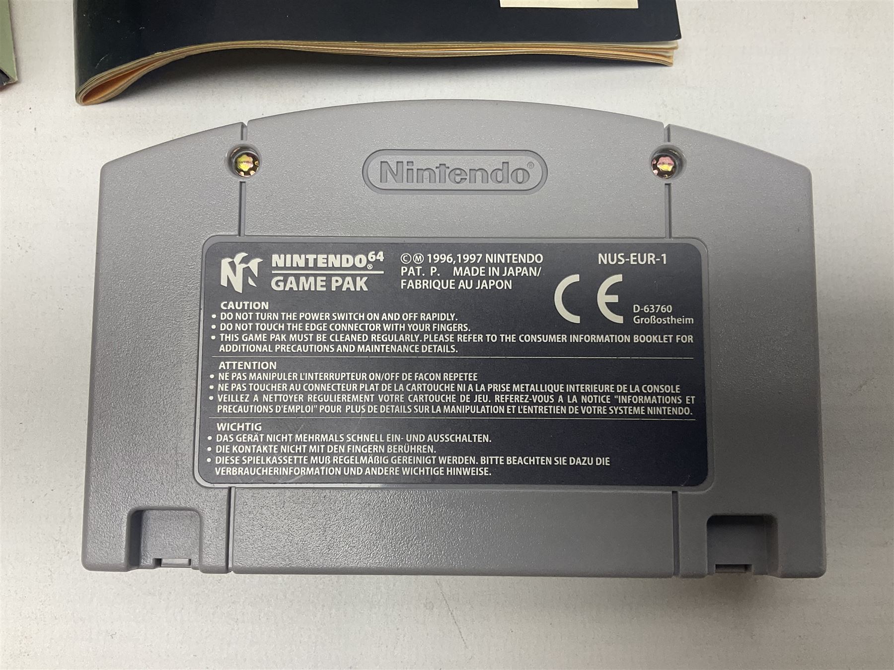 Nintendo 64 console, two controllers, games and accessories. Accessories to include the ‘Tremorpak’ and ‘Spook’ 2 Phono plugs and a S-VHS plug with adapter, both in original boxes. Games to include ‘Golden Eye 007’, ‘Doom 64’, ‘Killer Instinct Gold’, ‘Tetrisphere’, ‘F-1 World Grand Prix’, ‘Pilotwings 64’ and ‘Lylatwars’ with ‘Rumble Pak’, all with original boxes and instruction manuals. ‘Star Wars Episode I Racer’ game cartridge in Shadows of the Empire box. 