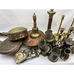 A group of assorted metalwares, to include a brass Corinthian column, H39cm, two pairs of brass candlesticks, two rectangular copper platers, bed warming pans, silver plated tea wares, pestle and mortars, assorted silver plated flatware, etc. 