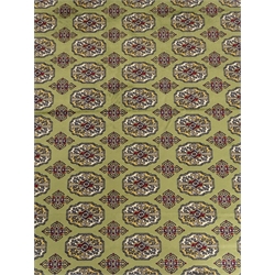  Bokhara green ground carpet, geometric patterned field, repeating border, 300cm x 200cm  