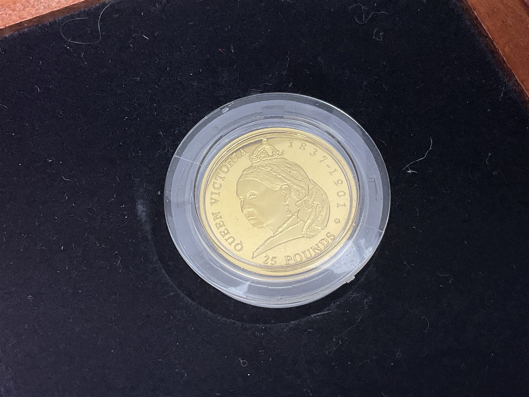 Single owner lifetime collection of mostly commemorative modern World coins with gold, silver and base metal examples, including two Queen Elizabeth II Bailiwick of Guernsey twenty-five pound gold coins 'The 1999 Royal Wedding' and '100th Anniversary of the End of the Victorian Era' 2001 each in 24 carat gold weighing 7.81 grams with certificates, silver coins commemorating the Millennium 2000 including Guyana sterling silver proof two-thousand dollars, Fiji sterling silver proof five dollars etc, silver coins from the Queen Elizabeth II Golden Jubilee Collection dated either 2002 or 2003 from Great Britain and the Commonwealth countries, United Kingdom commemorative crowns in card folders, The Royal Mint United Kingdom 1997 proof coin set in red folder without certificate etc