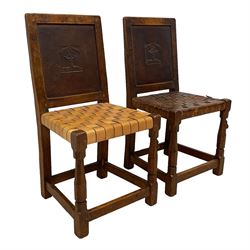 Mouseman - circa. 1930s set of six (4+2) oak dining chairs, panelled back carved with the Bagshawe family crest, the moto 'Forma Flos Fama Flatus' over an arm grasping a bugle-horn with ribbon tie and Yorkshire rose motif, adzed frame, leather lattice strap seat, on octagonal supports united by stretchers, two carvers and four side chairs, each carved with mouse signature, by Robert Thompson of Kilburn 

Provenance: Owned since manufacture by the Bagshawe family, descendants of the Staithes Group Artist Joseph Richard Bagshawe RBA (1870-1909).