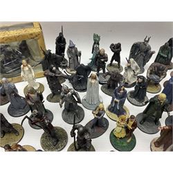 Approximately 80 NLP Lord of the Rings heavy metal painted figurines to include Fell Beast, boxed, and The Watcher, The Dark Lord Sauron, Treebeard etc, and unassociated Dracula themed composite figures marked HHFT50 