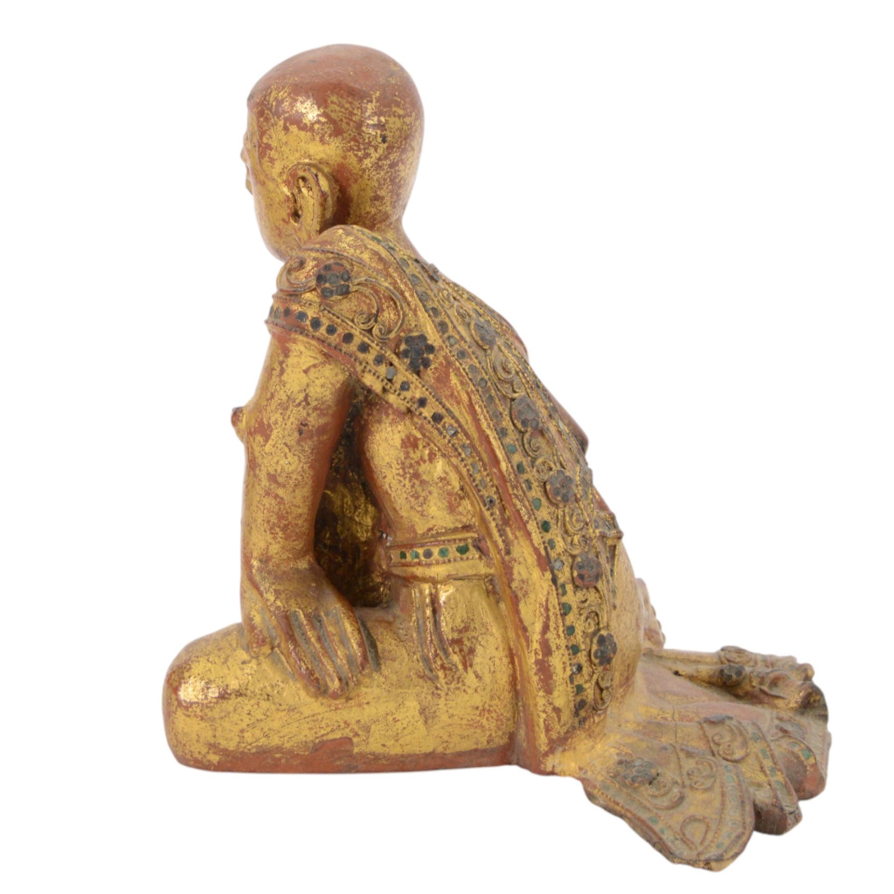 Late 19th century two Burmese Mandalay lacquered and gilt wood figures of monks, the robes edged with colored glass inlay and leafy scroll bands in raised lacquer, H25cm