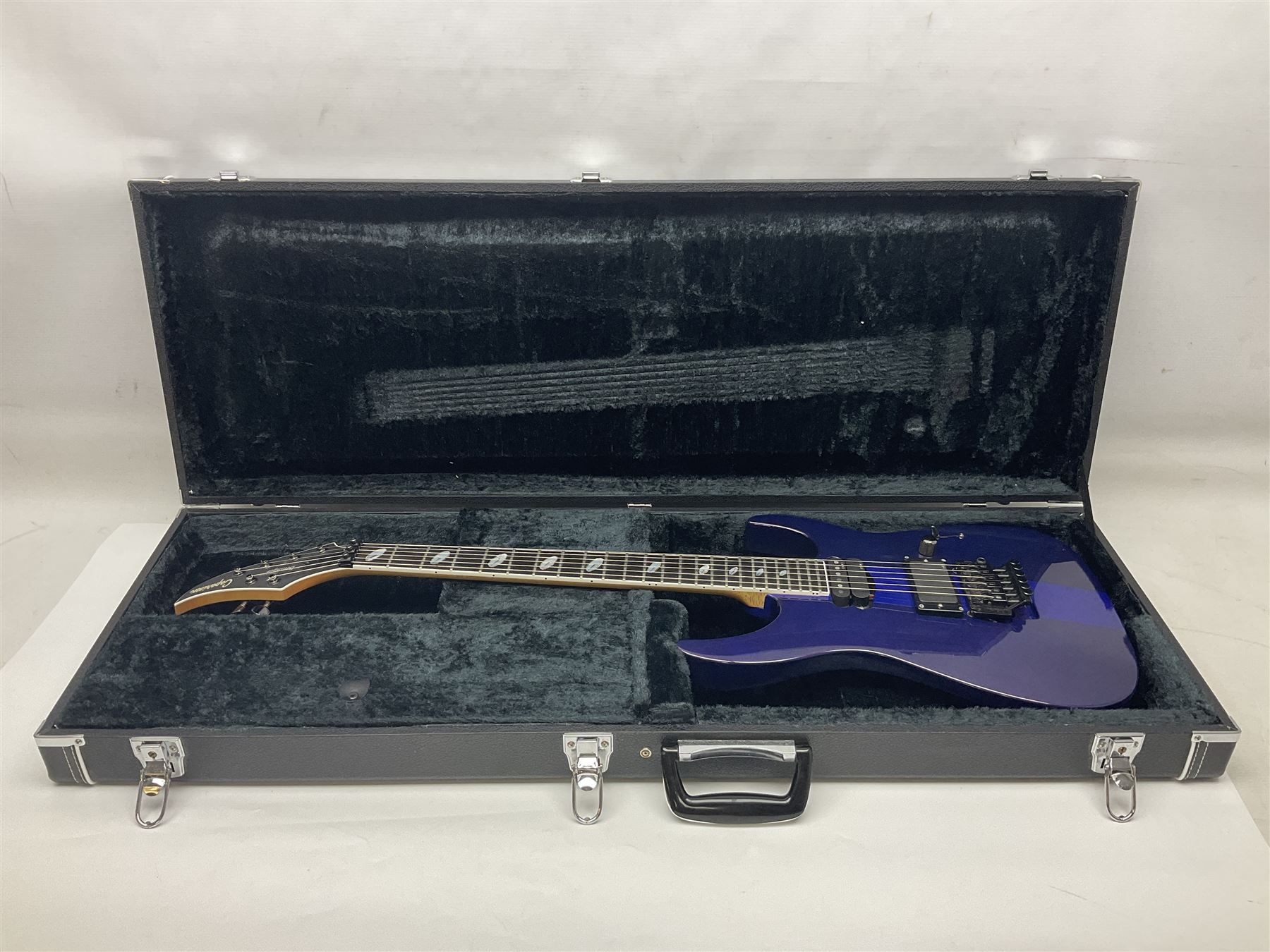 2015 Japanese Caparison Dellinger Prominence hand made boutique rock guitar in spectrum blue with clock inlays and Scaller tremolo; serial no.3200018; L100cm; in fitted case with certificate, registration card, tools etc