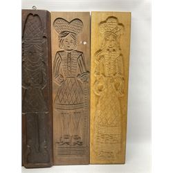 Eight 20th century hardwood Dutch folk art Speculaasplank or biscuit moulds, most examples typically carved with figures in traditional dress, tallest H60cm
