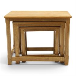 Mouseman - nest of three oak occasional tables, rectangular adzed top, on octagonal supports united by plain stretchers, each carved with mouse signature, by the workshop of Robert Thompson of Kilburn