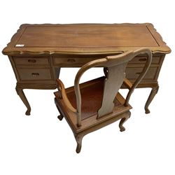 Hong Kong hardwood desk, shaped moulded top over four drawers, shaped aprons carved with scrolls, on shell carved cabriole supports; together with matching elbow chair