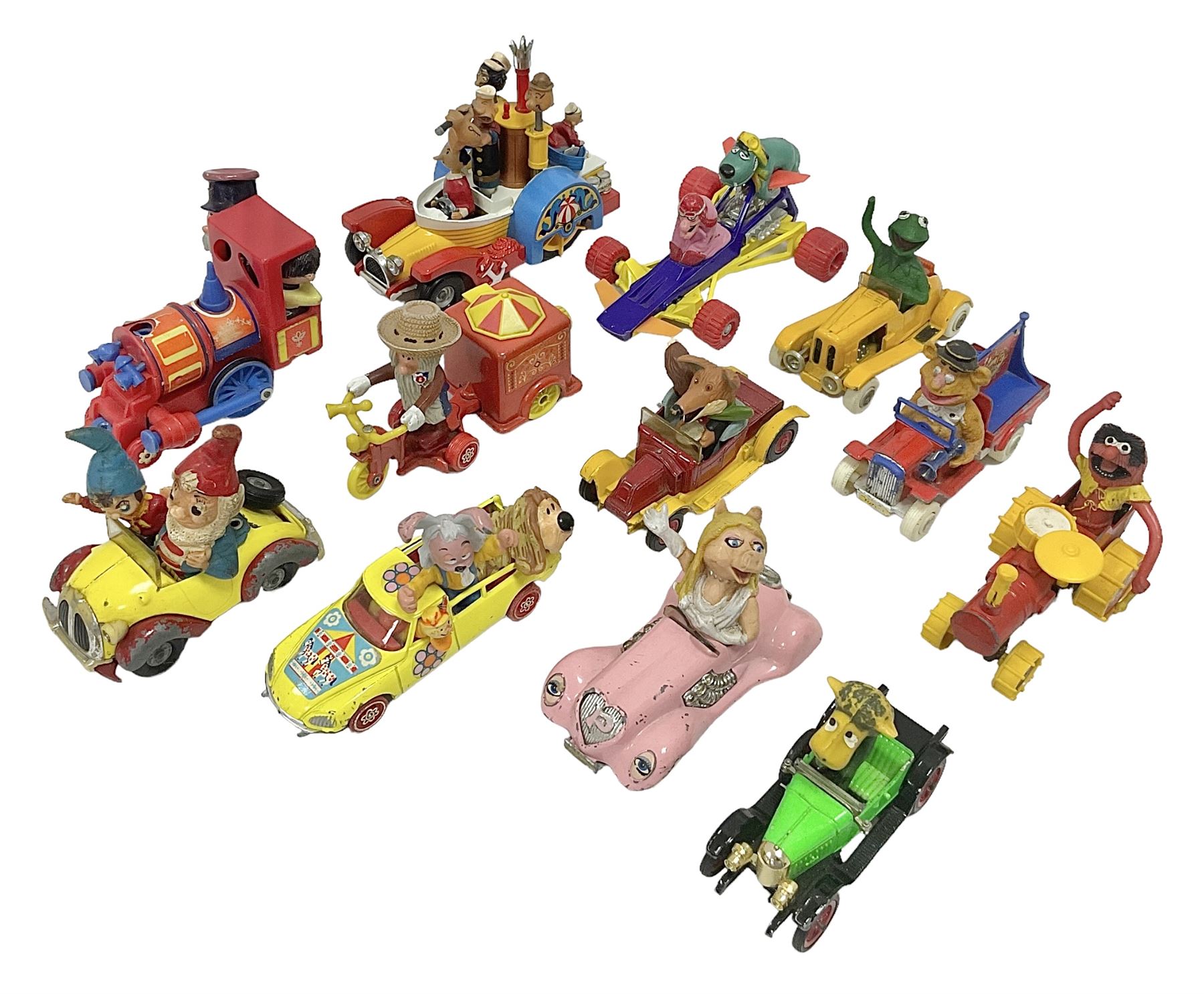 Corgi/Dinky - twelve unboxed and playworn TV/Film related die-cast models including Popeye Paddle Wagon; Dick Dastardly; Magic Roundabout; Muppets; Basil Brush; and Noddy (12)