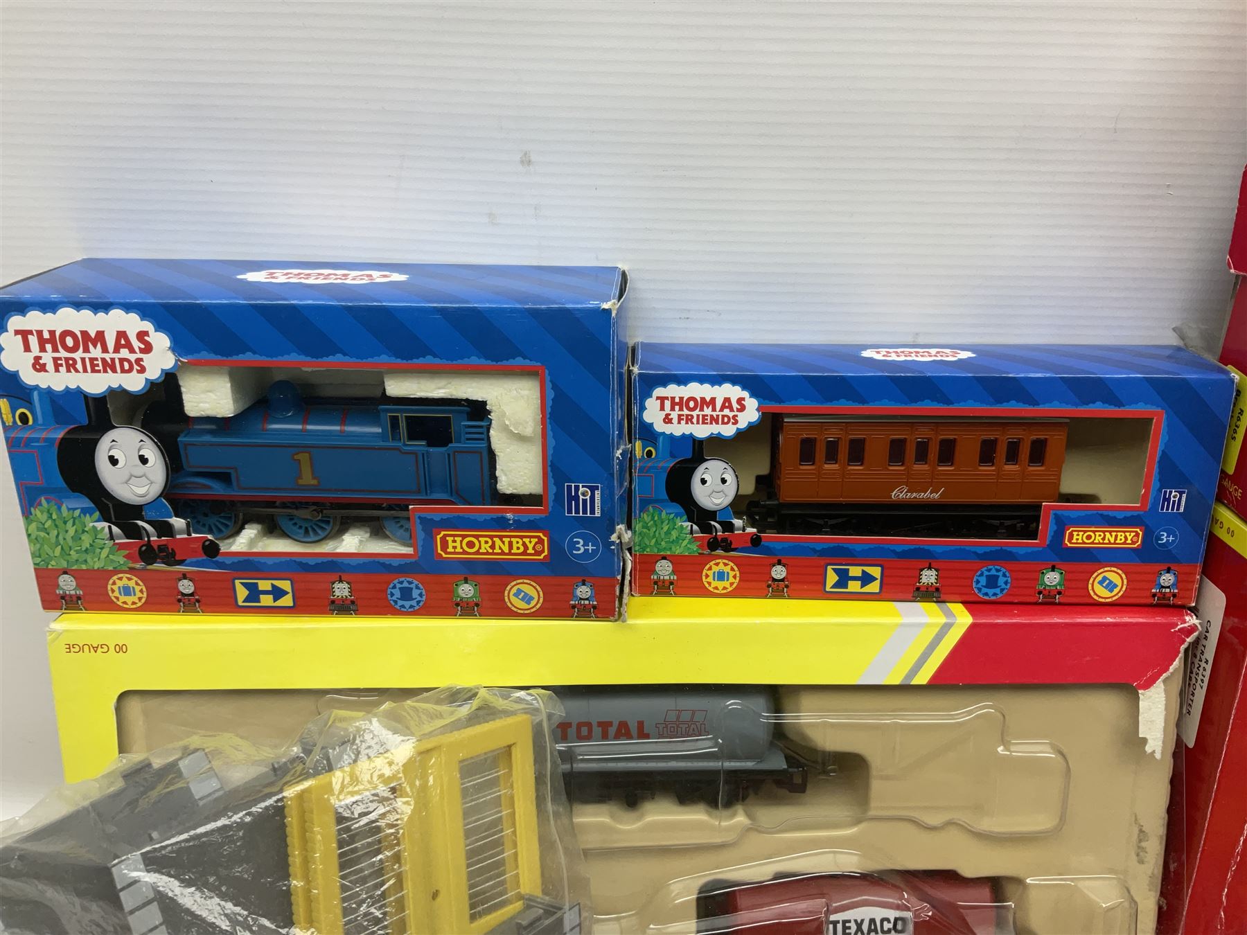 Hornby '00' gauge - Thomas the Tank Engine and Friends 0-6-0 tank locomotive No.1 with Annie and Clarabel coaches; all boxed; Breakdown Pack, Car Transporter Pack, Fuel Tanker Pack and Automatic Level Crossing; all boxed; Lima Car Transporter; boxed; and quantity of trackside accessories etc