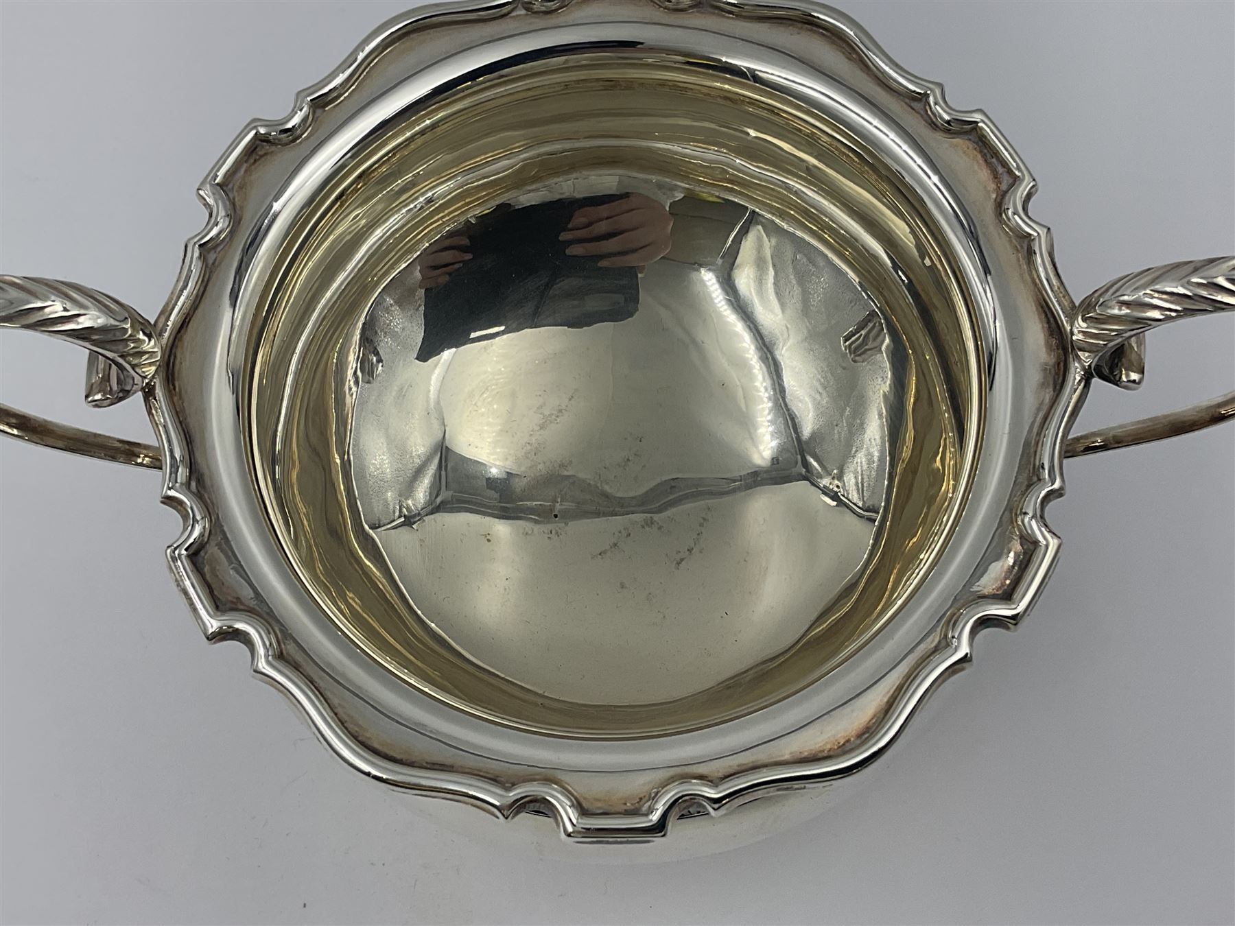 1920s five-piece silver tea service, comprising teapot, coffee pot, hot water pot, twin handled open sucrier and milk jug, each of squat circular form with shaped rim, the teapot, coffee pot and hot water pot each with ebonised handle and finial, the sucrier and milk jug with acanthus capped scroll handles, all upon circular foot, hallmarked R F Mosley & Co, Sheffield 1926 & 1927, tallest H24cm