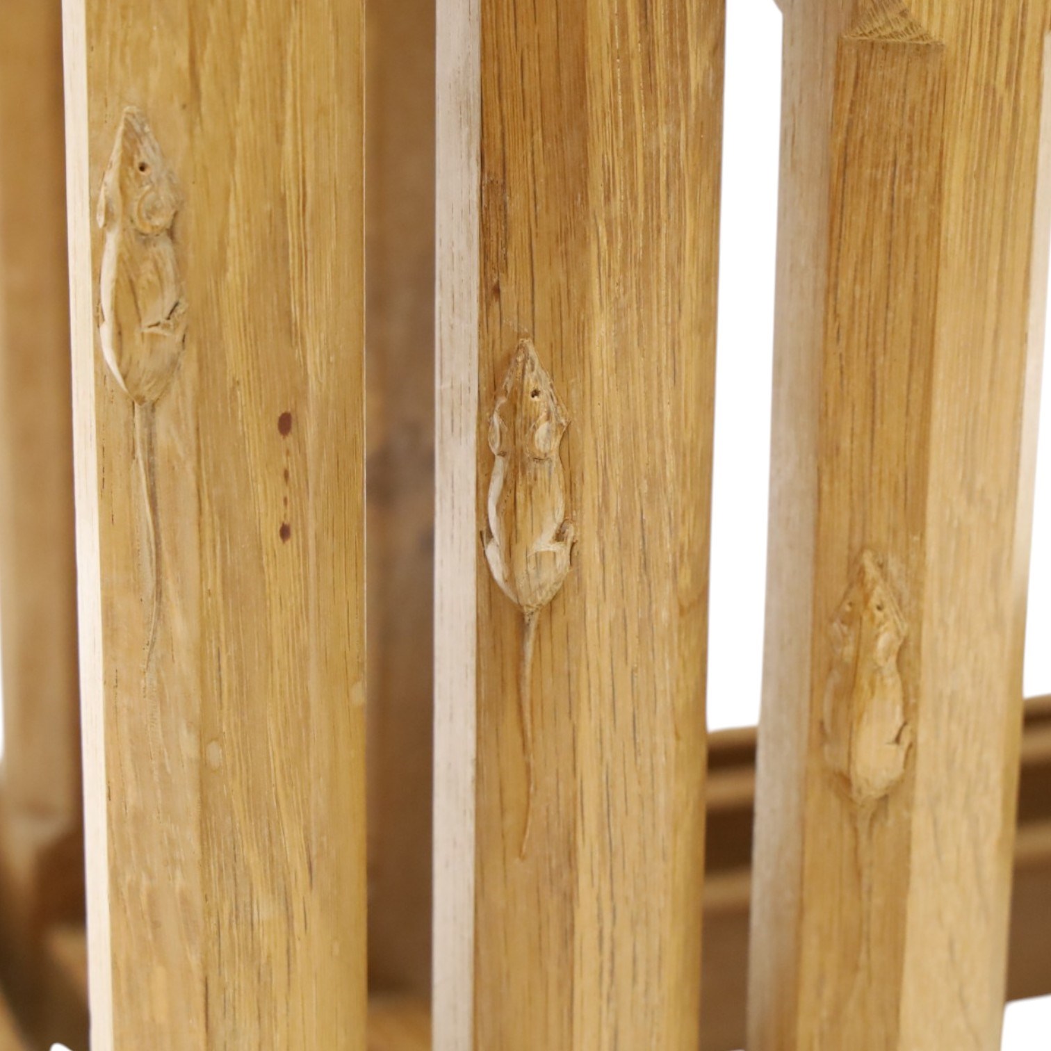 Mouseman - nest of three oak occasional tables, rectangular adzed top, on octagonal supports united by plain stretchers, each carved with mouse signature, by the workshop of Robert Thompson of Kilburn
