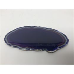 Four purple agate slices of various sizes, polished with rough edges