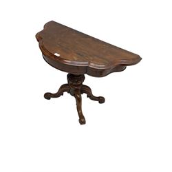 Victorian rosewood serpentine tea table, scallop shaped fold-over and swivel top, raised on egg and dart carved baluster pedestal terminating in four scroll carved cabriole splay supports