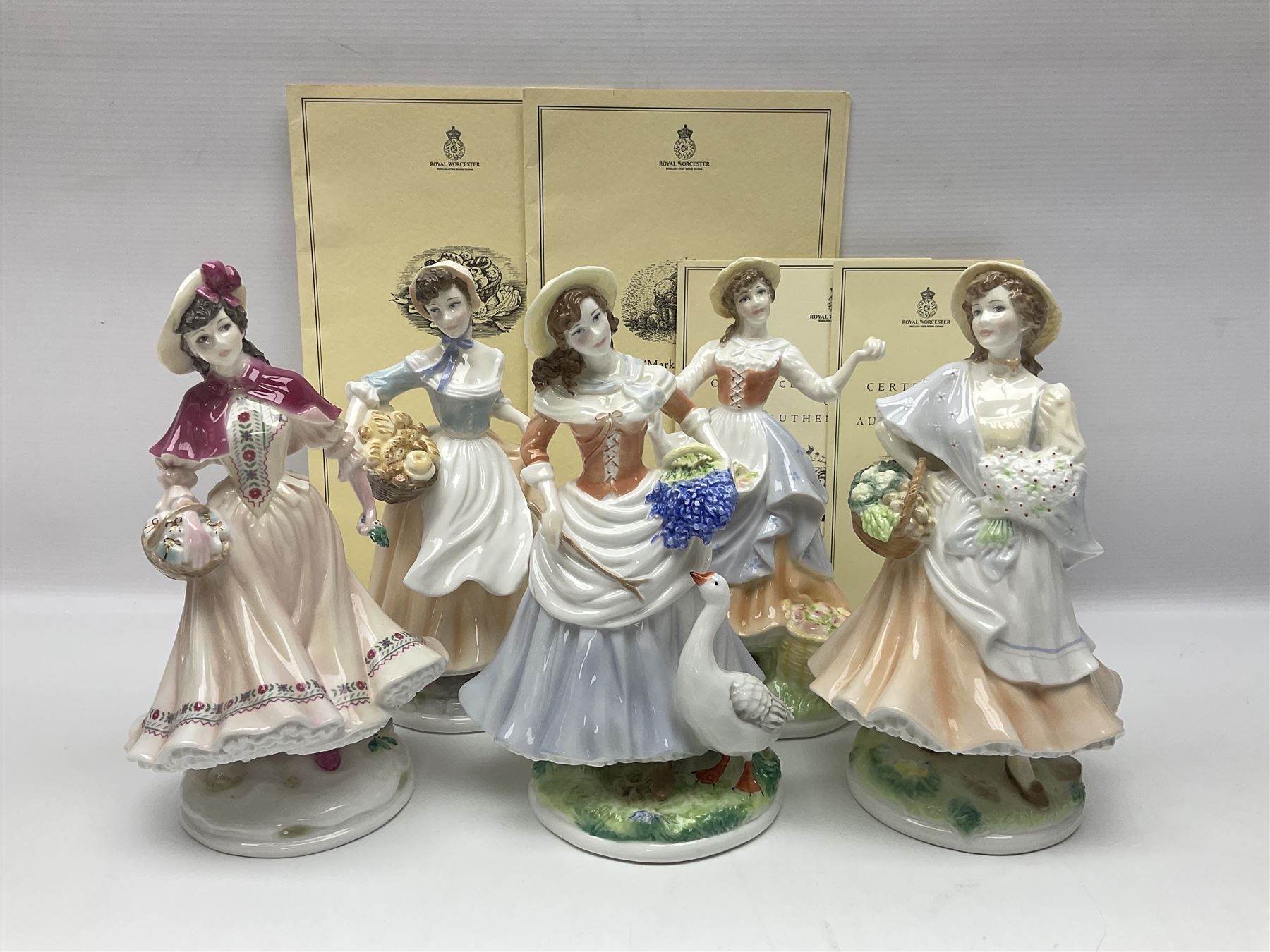 Five Royal Worcester figures, comprising Market Day, Noelle, Bakers Wife, Goose Girl and Fruit Picking, all with printed marks beneath and some with certificates of authentication  