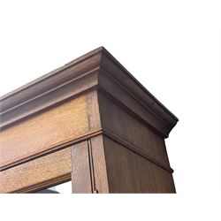 Late 19th century mahogany bookcase on chest, projecting moulded cornice over twin astragal glazed doors enclosing three shelves, base fitted with three graduated drawers, raised on shaped bracket supports
